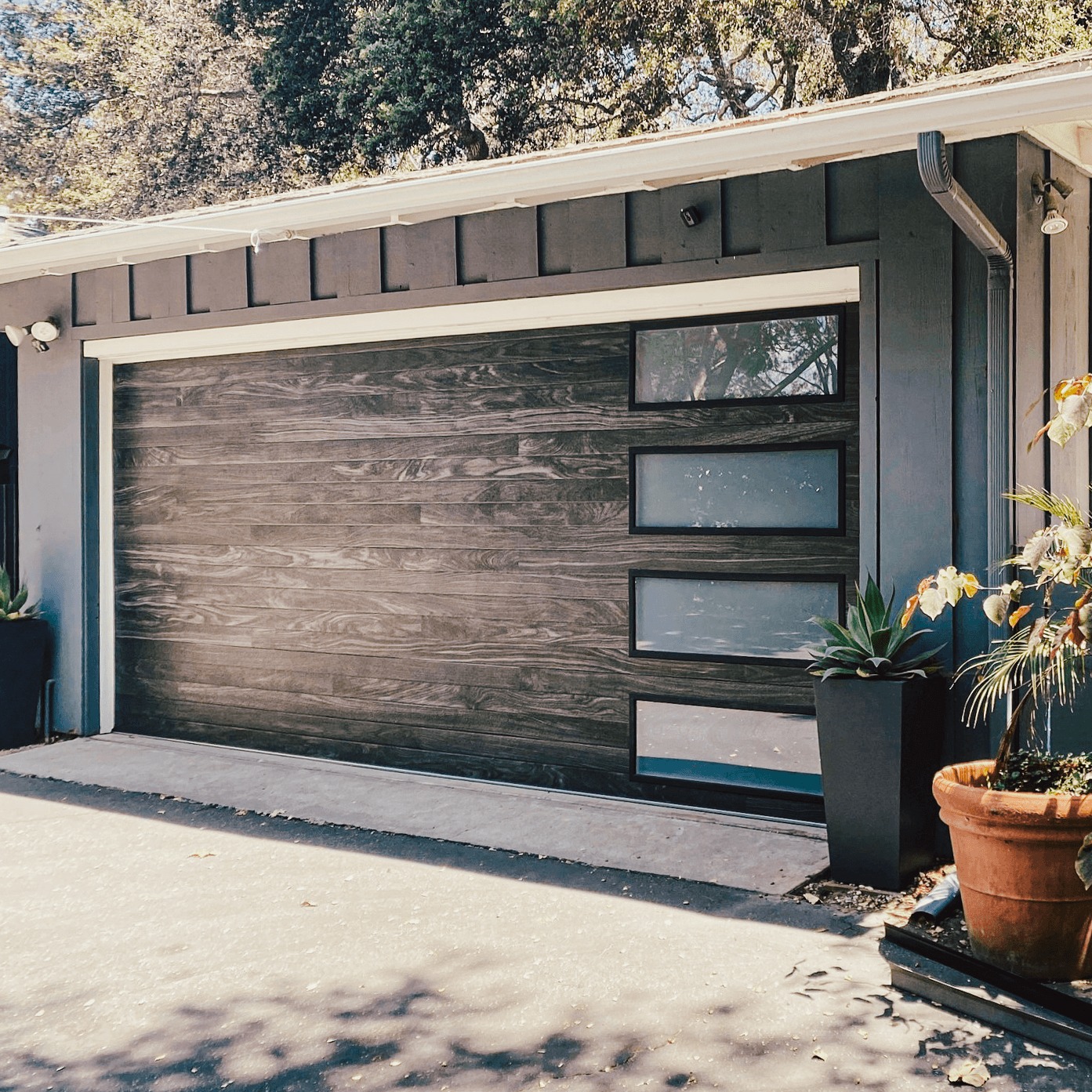 A1 garage door repair technician servicing a garage door in Mount Laurel, NJ
